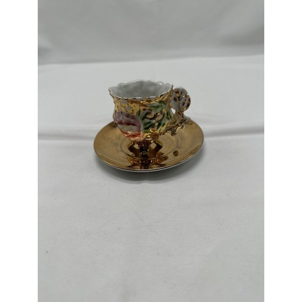 vintage gold& white with rose & footed feet & thumb handle